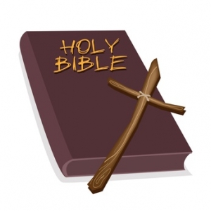 A Brown Holy Bible with A Wooden Cross