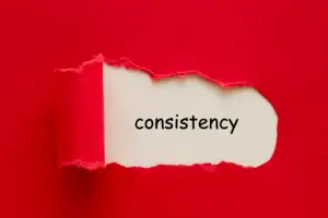 Consistency word written under torn paper.